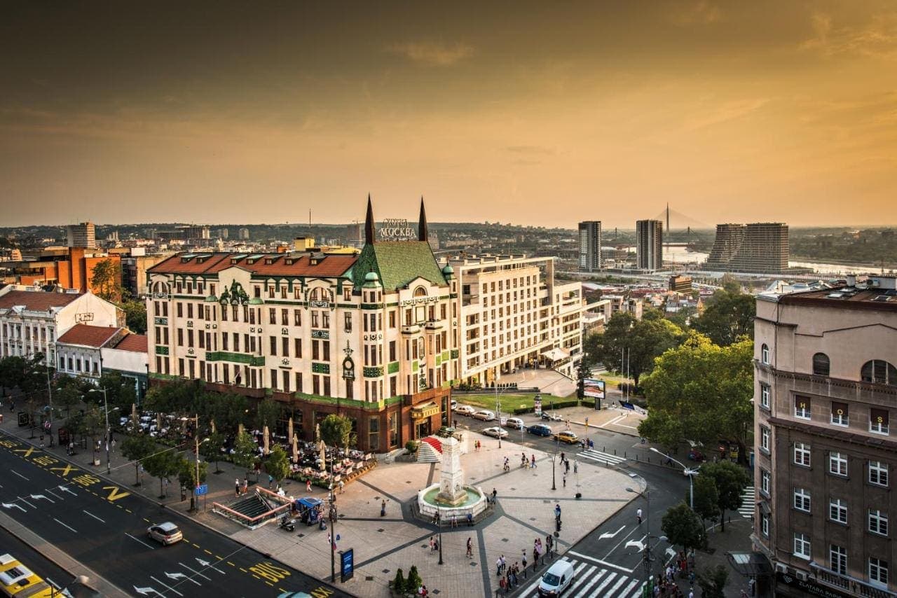The hotel at golden hour, overlooking the city