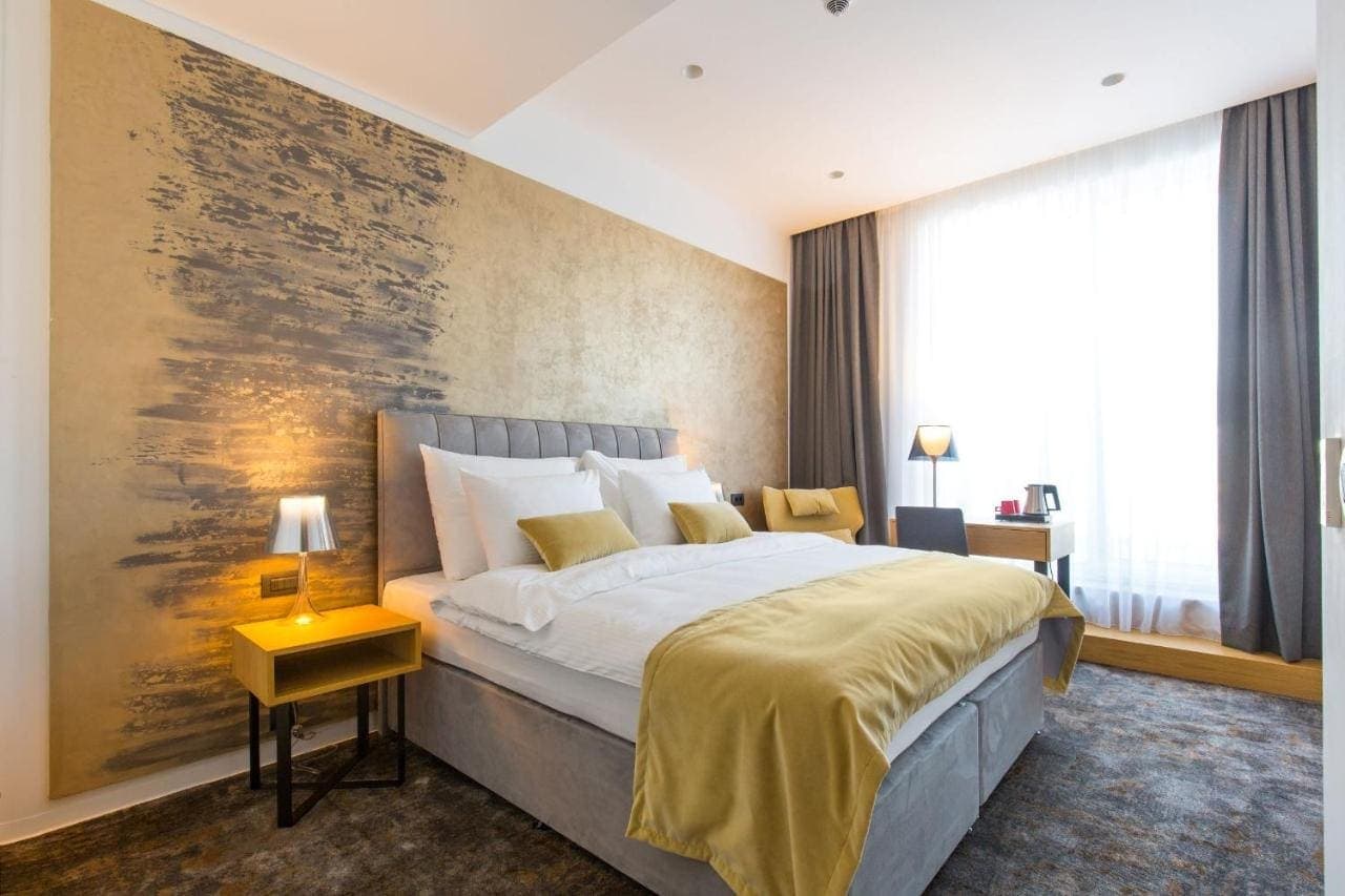 A double room in warm gold and grey