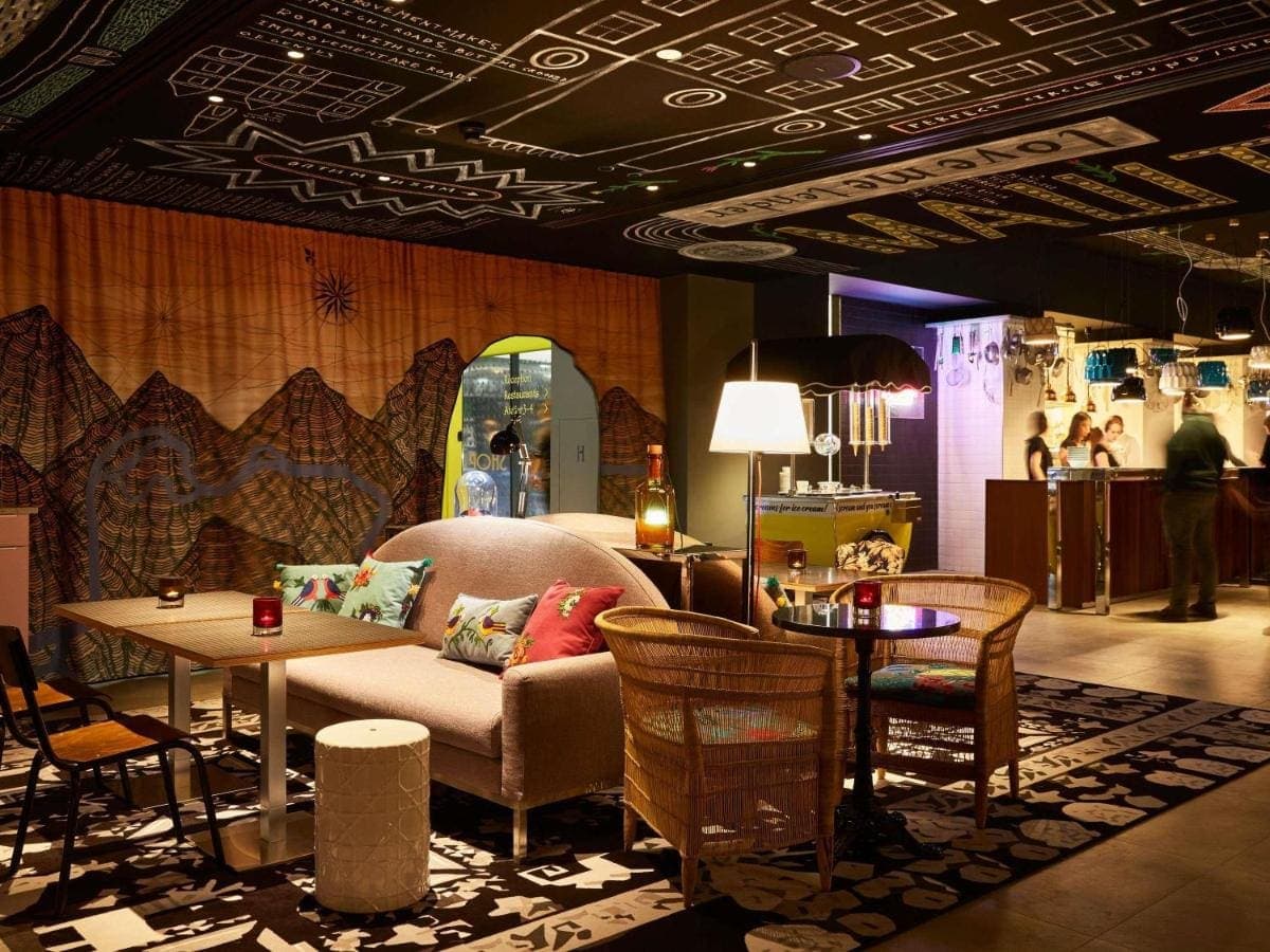 The colourful lobby lounge with sofas and lamps