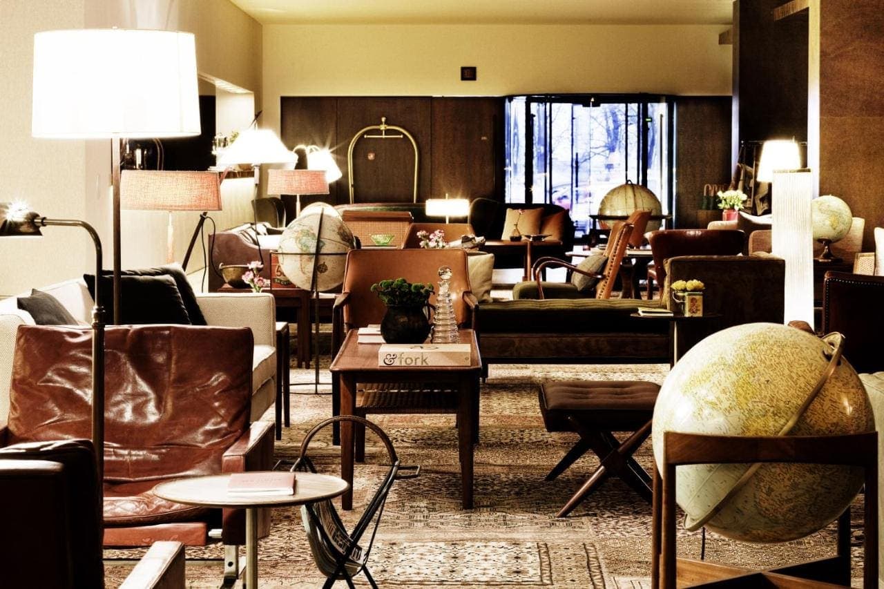 The lobby lounge with leather chairs and an old globe